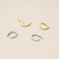 Flatlay view of Cable Ear Cuff Cartilage Earrings in Sterling Silver