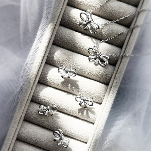 Bow Tie Necklace Style N1588-01, Bow Tie Stud Earrings Style E1698-01 in Flatlay Display