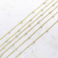 Flatlay view of Station CZ Station Necklace in Sterling Silver, Yellow Gold Flashed / 16 inch + 2 inch extension