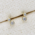 Flatlay view of Cartilage Graduated CZ Cartilage Stud Earrings in Sterling Silver, Yellow Gold Flashed