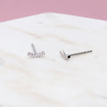 Flatlay view of Bar CZ Stud Earrings in Sterling Silver, Yellow Gold Flashed