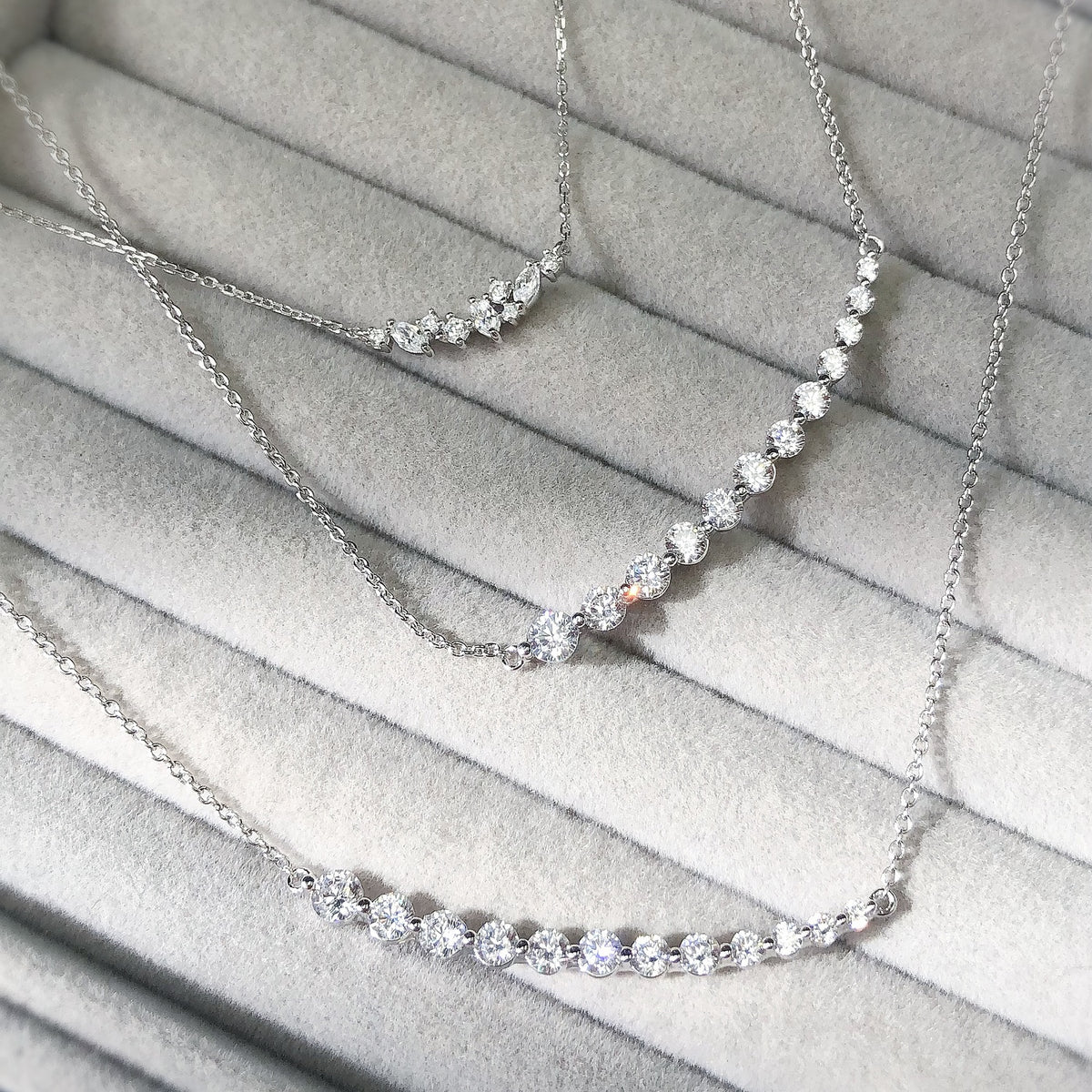 Cluster Necklace Style N1617-01, Graduated Necklace Style N1581-01 in Flatlay Display