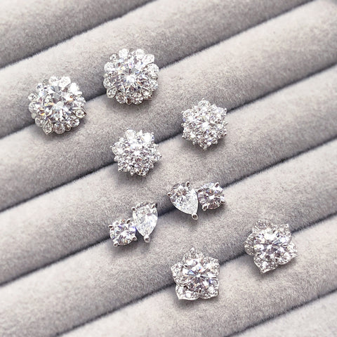 2-Stone Stud Earrings Style E1692-01, Flower Stud Earrings Style E1198-01 in Flatlay Display