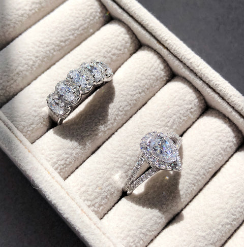 5-Stone Band Ring Style R1461-01, Halo Split Shank Ring Style R1580-01 in Flatlay Display