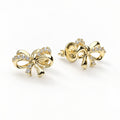 Angle view of Bow Tie Ribbon CZ Stud Earrings in Gold Flashed Sterling Silver, Gold Plated, CZ