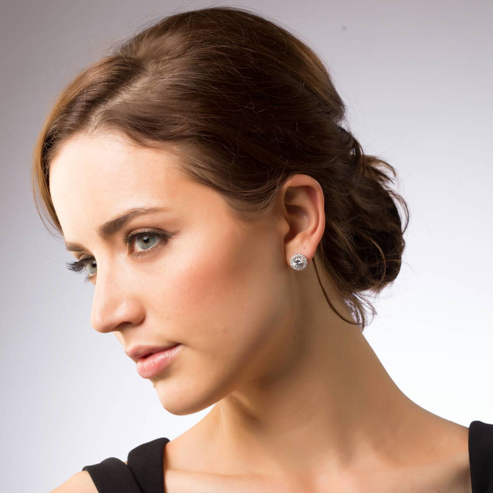 Model wearing Halo CZ Stud Earrings in Gold Flashed Sterling Silver, Clear