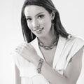 Model wearing Open Circle Statement Necklace, Black And Rose Gold-Tone