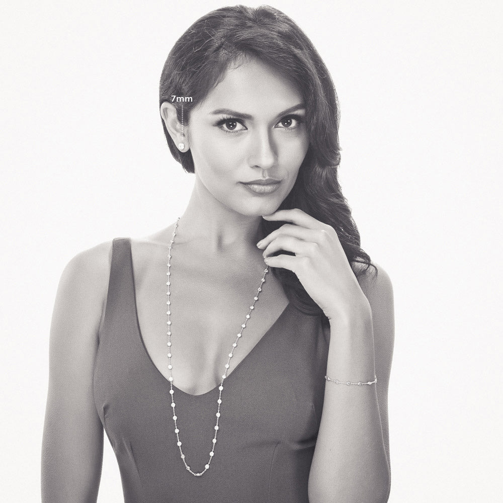 Model wearing Solitaire Bezel CZ Stud Earrings in Gold Flashed Sterling Silver, Rhodium Plated, Clear / 7mm
