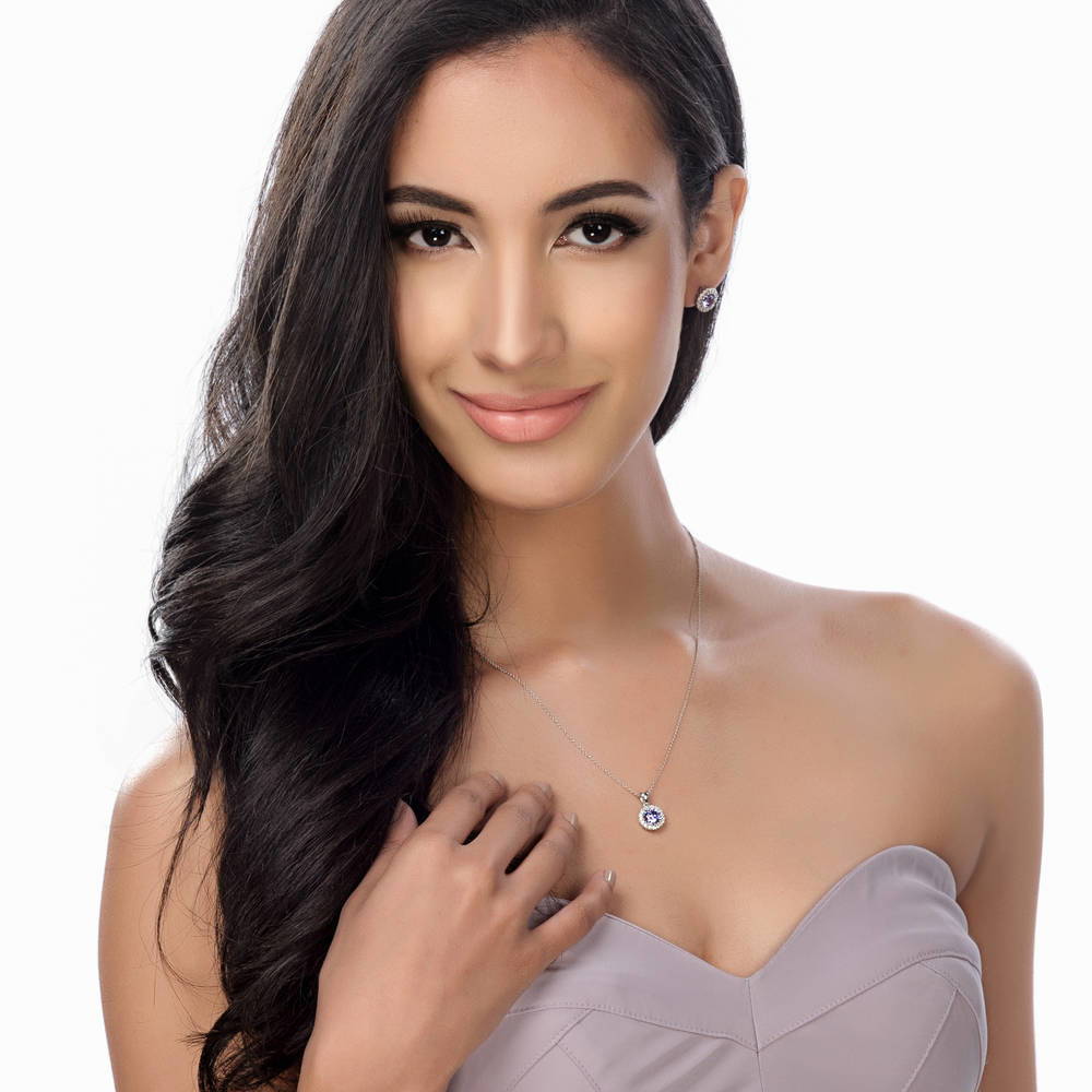 Model wearing Halo CZ Stud Earrings in Gold Flashed Sterling Silver, Purple