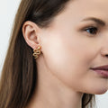 Model wearing Snake CZ Stud Earrings in Sterling Silver, Gold Flashed
