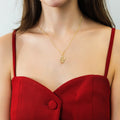 Model wearing Snake CZ Pendant Necklace in Sterling Silver, Gold Flashed