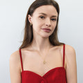 Model wearing Snake CZ Stud Earrings in Sterling Silver, Gold Flashed