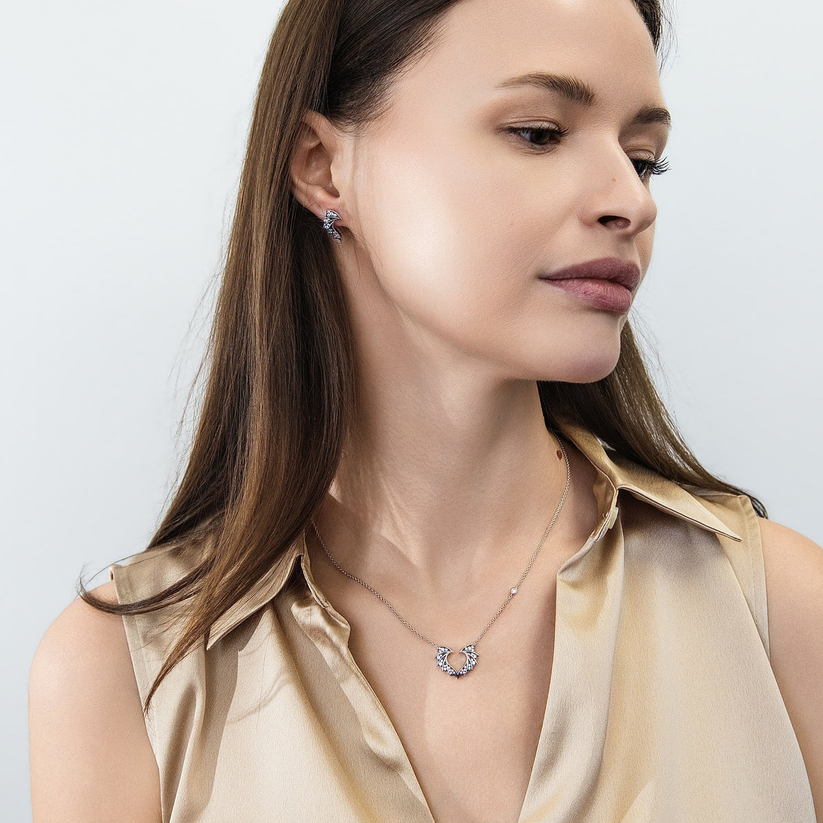 Model wearing Bat Wings CZ Stud Earrings in Sterling Silver, 7 of 8