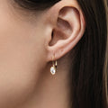 Model wearing Solitaire Oval Oval CZ Leverback Earrings in Sterling Silver, Gold Plated