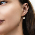 Model wearing Solitaire 2.6ct Pear CZ Leverback Earrings in Sterling Silver, Gold Flashed