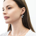 Model wearing Solitaire Emerald Cut CZ Leverback Earrings in Sterling Silver, Rhodium Plated