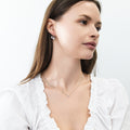 Model wearing Solitaire Bezel CZ Necklace in Sterling Silver, Rhodium Plated