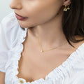 Model wearing Solitaire Bezel CZ Necklace in Sterling Silver, Gold Flashed