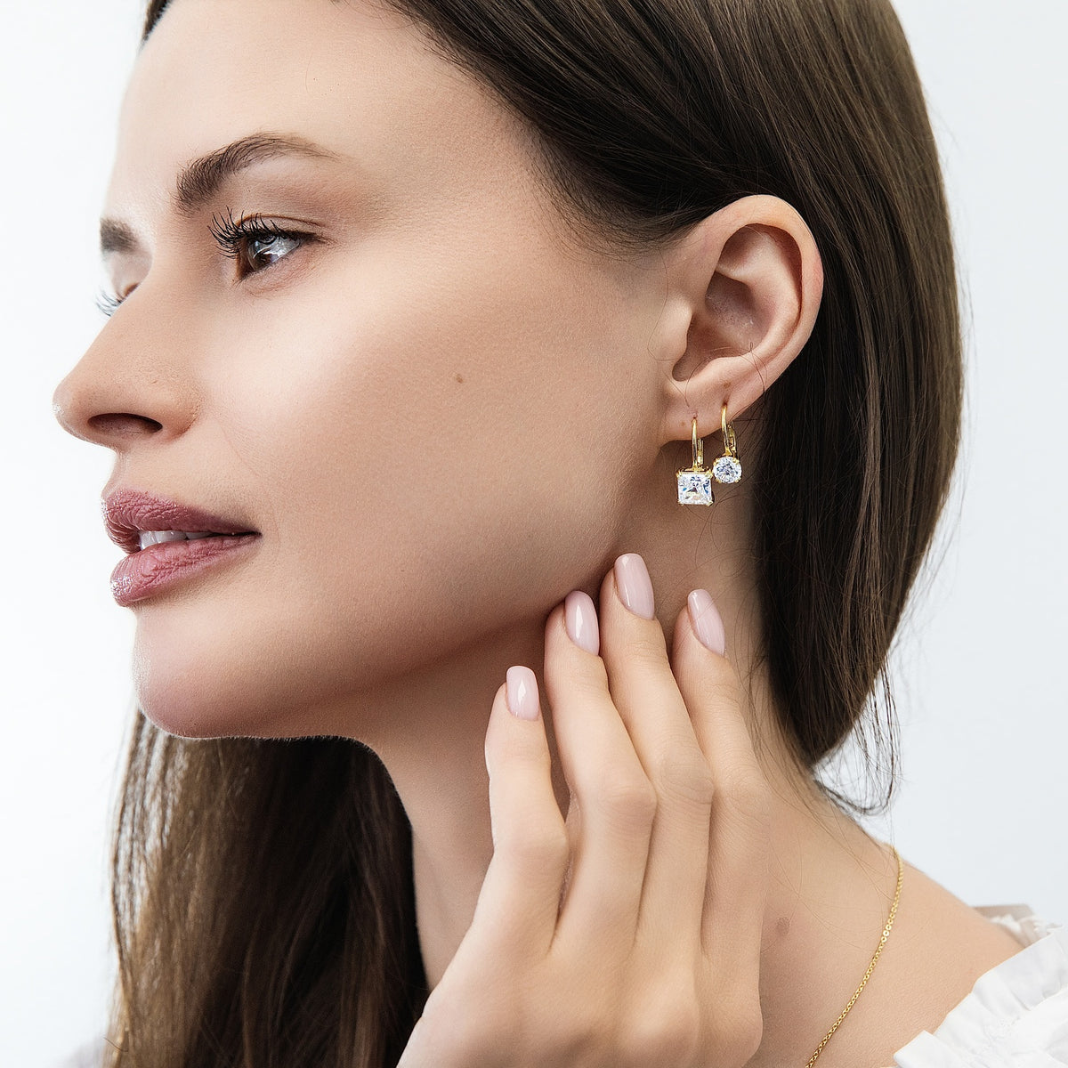 Model wearing Solitaire 4ct Princess CZ Leverback Earrings in Sterling Silver, Gold Flashed