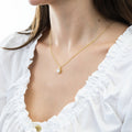Model wearing Solitaire 1.25ct Bezel CZ Necklace in Sterling Silver, Gold Flashed