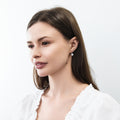 Model wearing Solitaire 2ct Crown Set CZ Earrings in Sterling Silver, Rhodium Plated