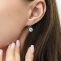 Model wearing Solitaire 2ct Crown Set CZ Earrings in Sterling Silver, Rhodium Plated