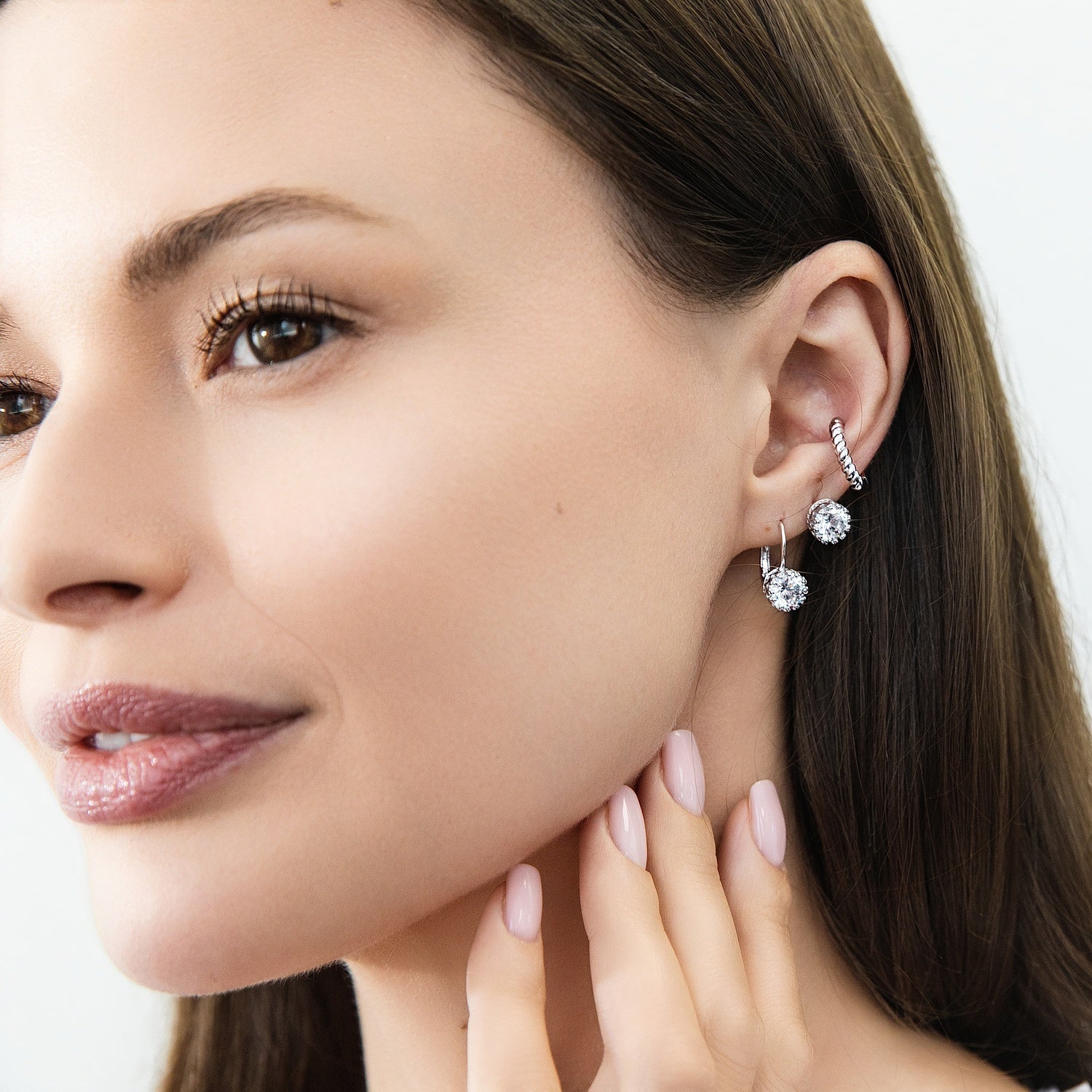 Model wearing Solitaire Cartilage CZ Cartilage Stud Earrings in Sterling Silver, Rhodium Plated
