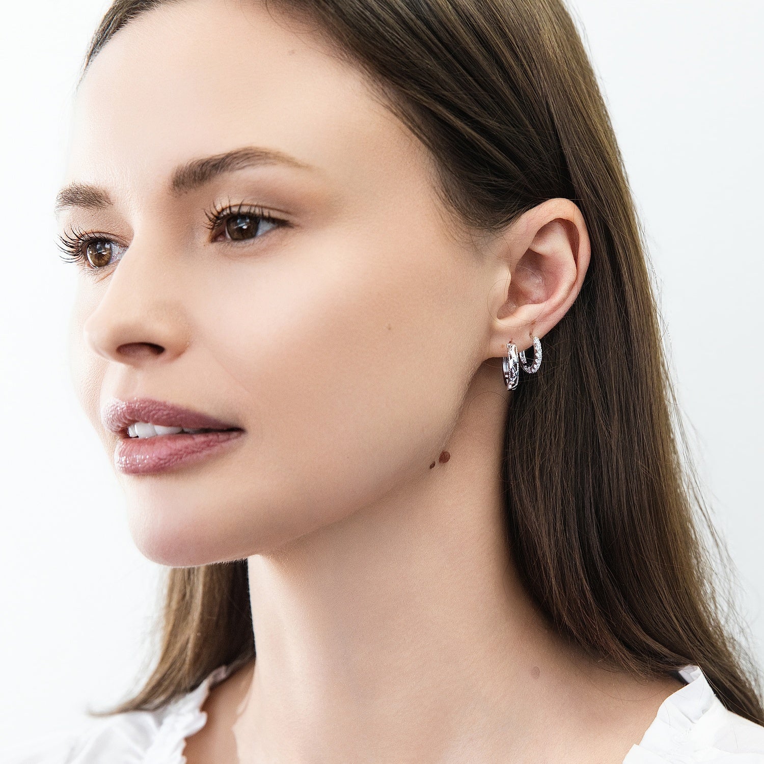 Model wearing 7-Stone CZ Small Hoop Earrings in Sterling Silver 0.6 inch, 6 of 9