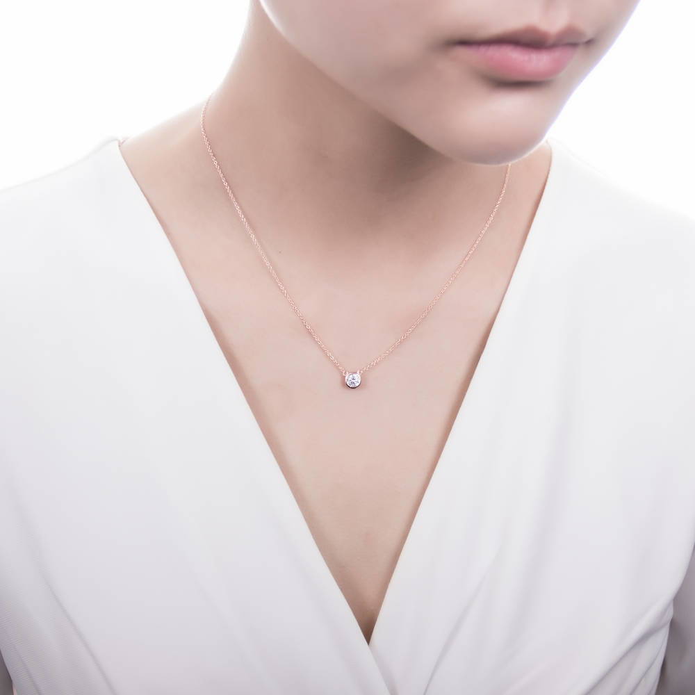 Model wearing Solitaire 0.45ct Bezel CZ Mini Necklace in Sterling Silver, Rhodium Plated