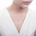 Model wearing Solitaire 0.45ct Bezel CZ Mini Necklace in Sterling Silver, Rhodium Plated