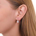 Model wearing Solitaire 1.6-2.6ct Pear CZ Leverback Earrings in Sterling Silver, Clear