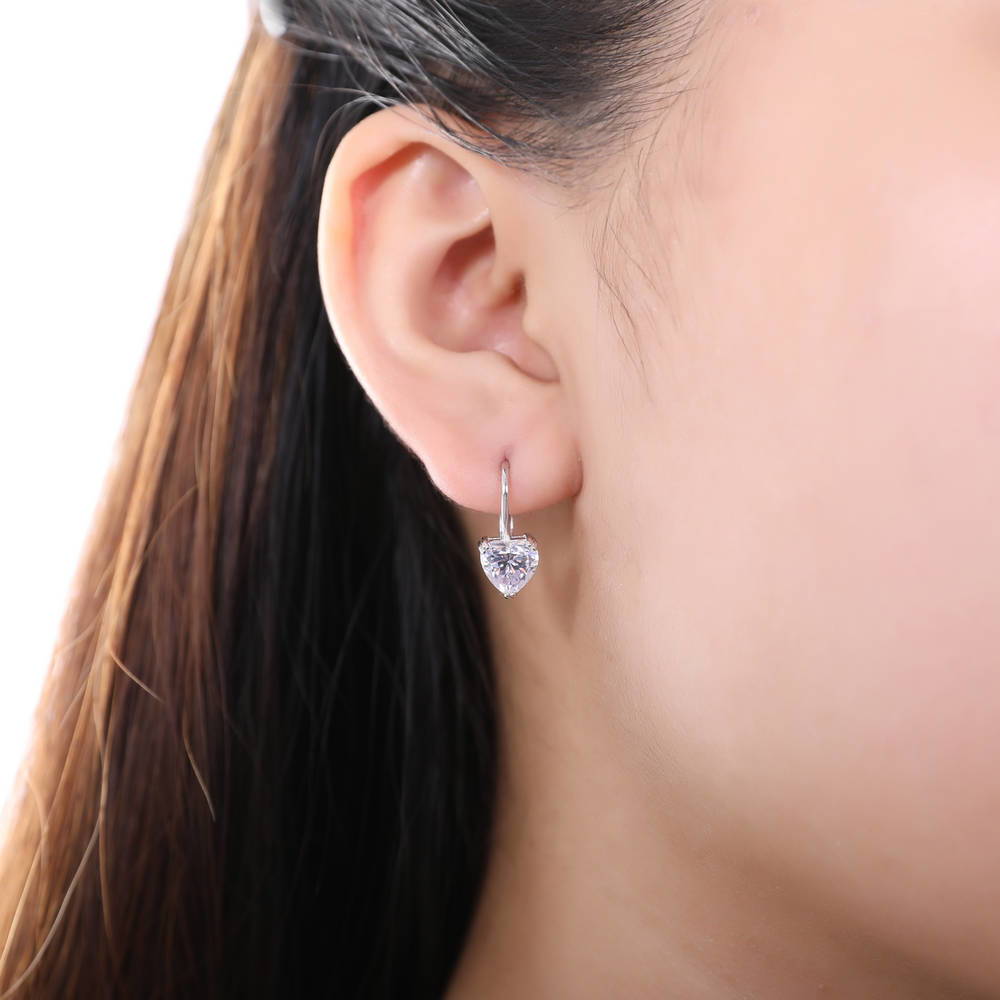 Model wearing Solitaire Heart Heart CZ Leverback Earrings in Sterling Silver, Clear Color