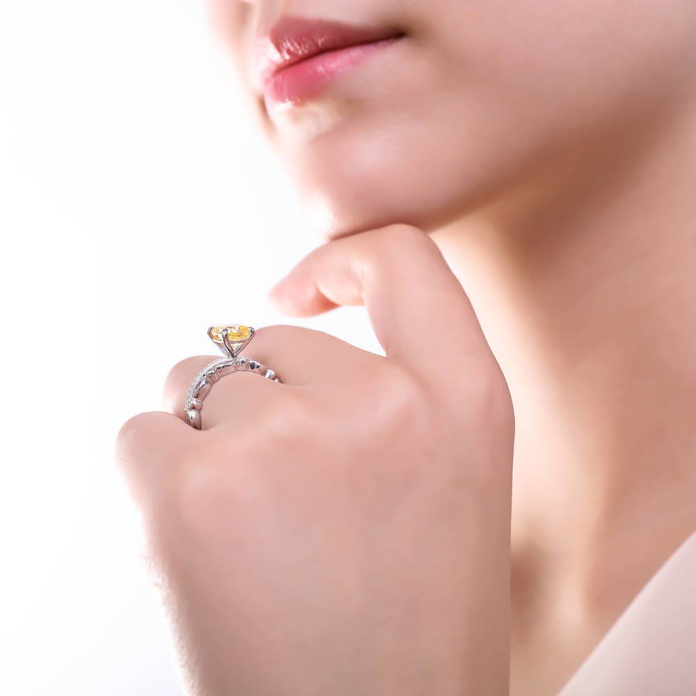 Model wearing Solitaire 3ct Canary Yellow Cushion CZ Ring in Sterling Silver, 12 of 19