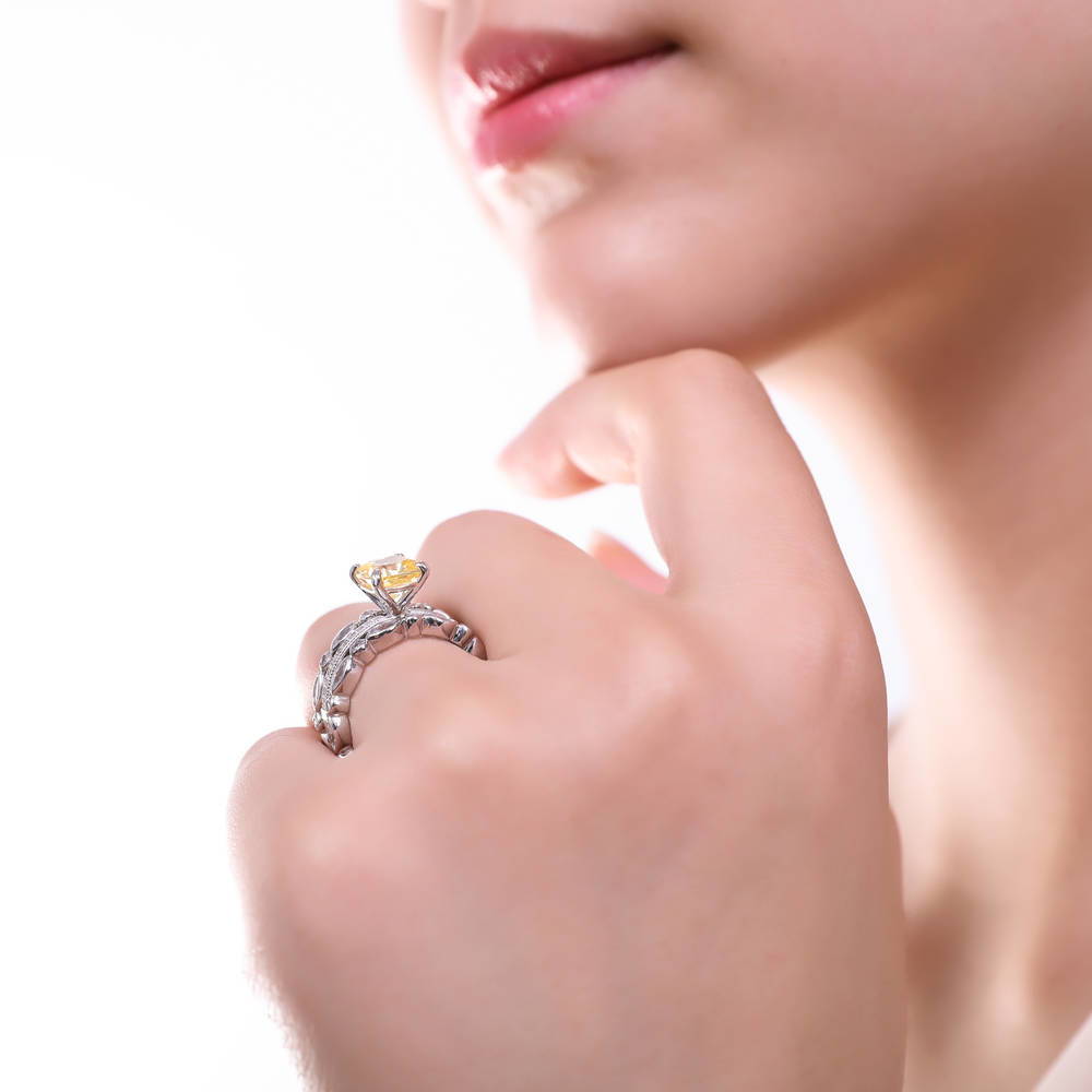 Model wearing Solitaire 3ct Canary Yellow Cushion CZ Ring in Sterling Silver, 18 of 19