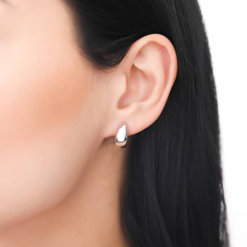 Model wearing Dome Huggie Earrings in Gold Flashed Sterling Silver, 2 Pairs, 9 of 20