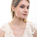 Model wearing Solitaire 1.6ct CZ Cartilage Stud Earrings in Sterling Silver, Greyish Blue