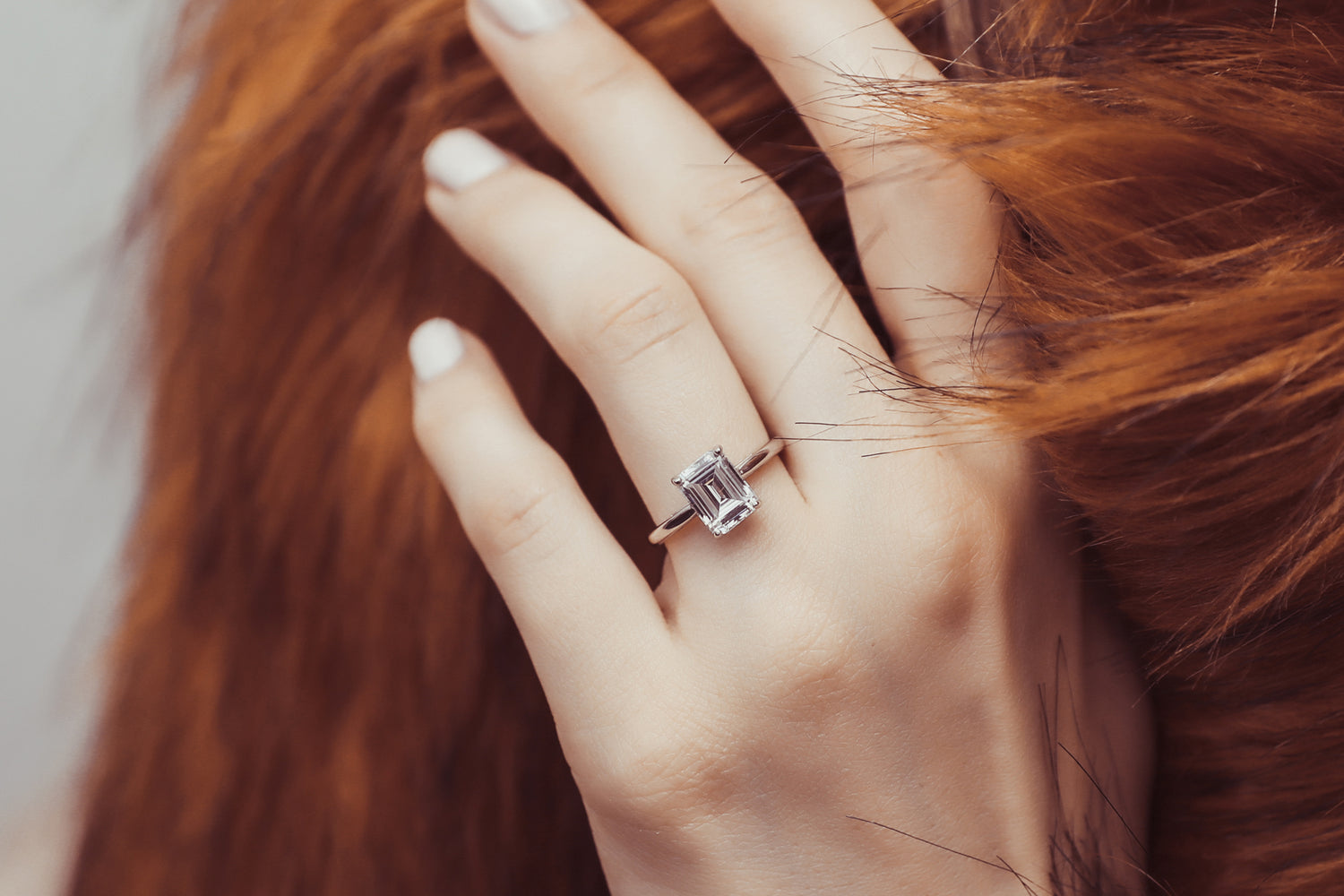 4. Regal Emerald-Cut Solitaire Engagement Ring