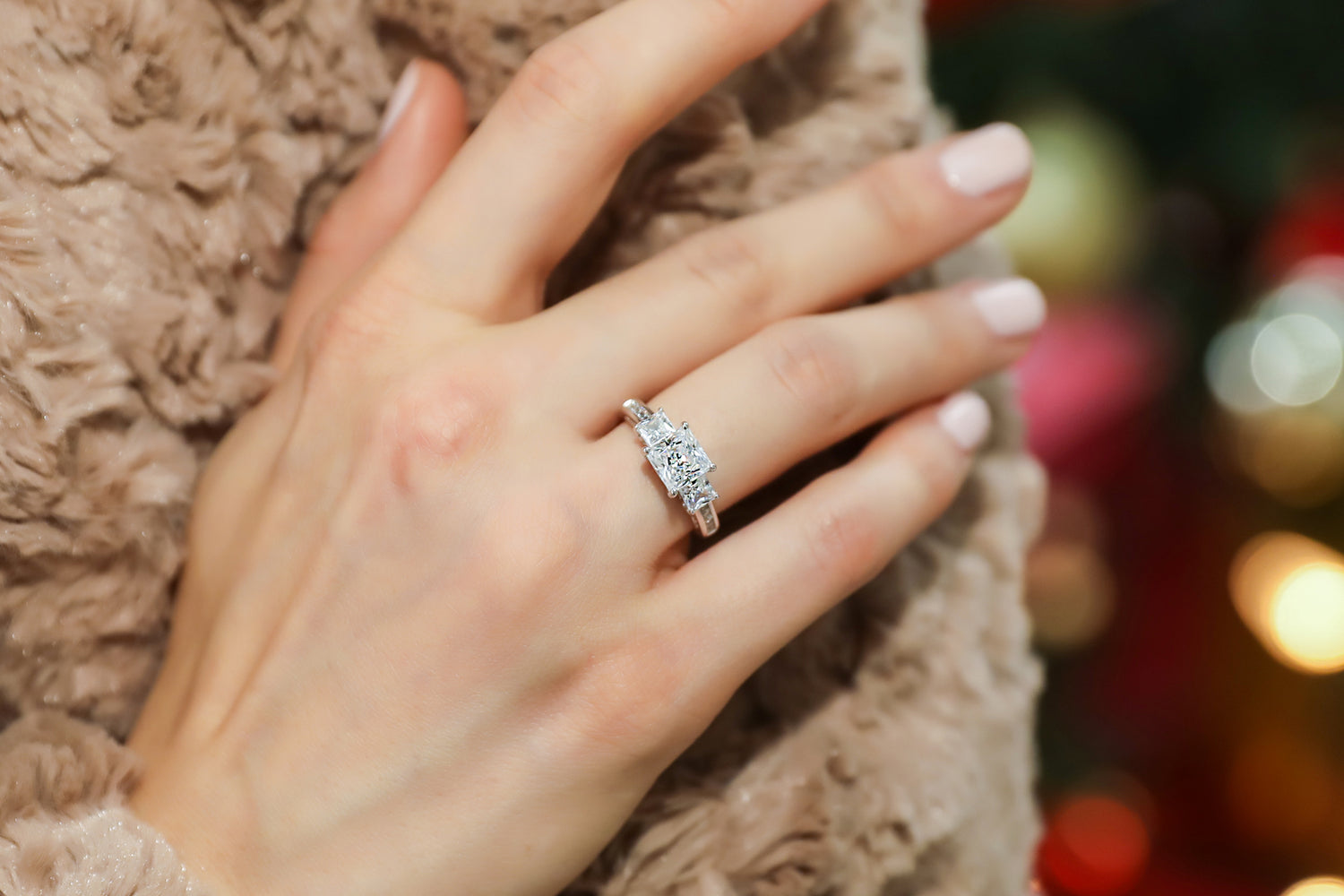 2. Elegant 3-Stone Engagement Ring