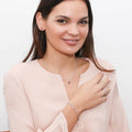 Model wearing Solitaire CZ Necklace in Sterling Silver, Round Cut / Red