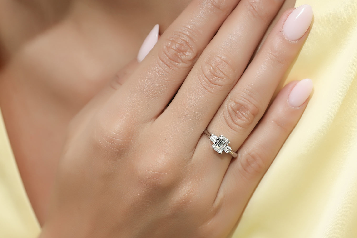 9. Minimalist 3-stone Emerald-Cut Engagement Ring