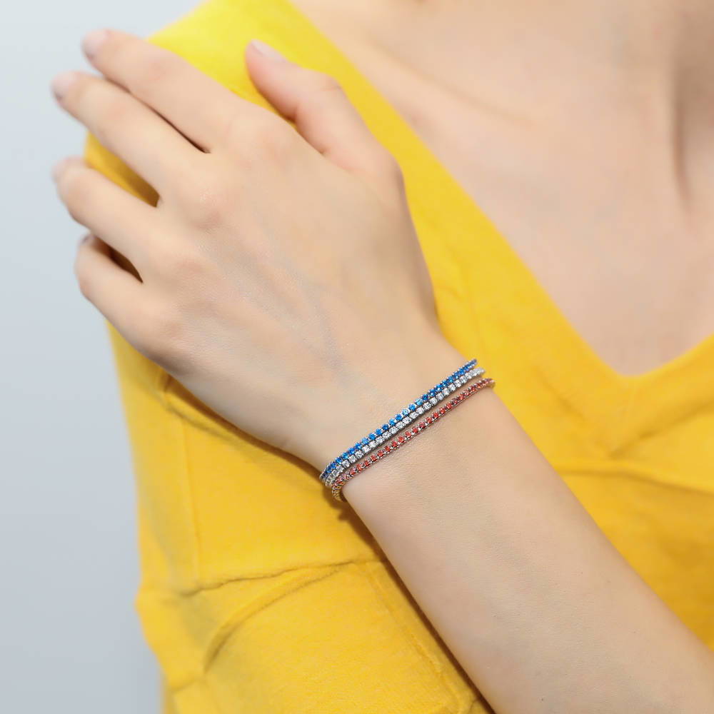 Model wearing CZ Tennis Bracelet Gold Flashed, Blue Color