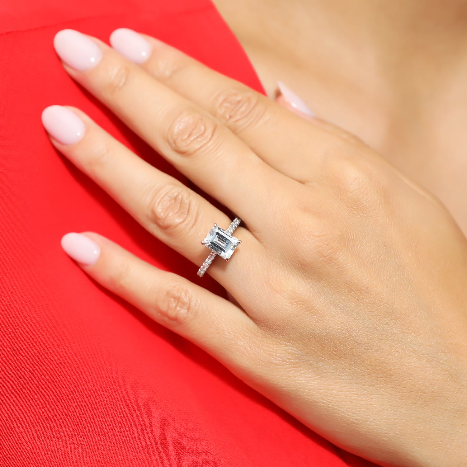 Model wearing Solitaire 2.6ct Emerald Cut CZ Ring in Sterling Silver, 7 of 9