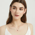 Model wearing Kaleidoscope Solitaire 0.8ct CZ Necklace in Sterling Silver, Red Orange Color