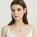 Model wearing Halo Kaleidoscope CZ Stud Earrings in Sterling Silver, Greyish Blue