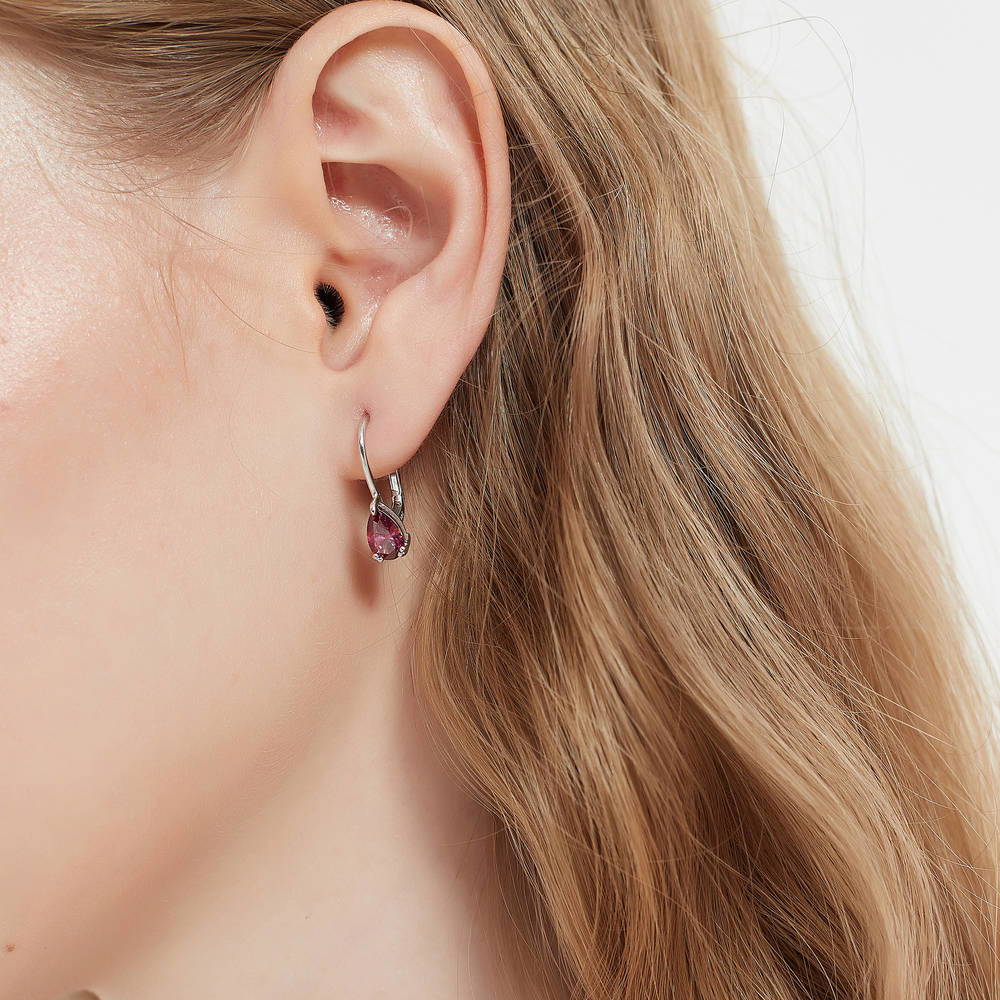 Model wearing Solitaire 1.6-2.6ct Pear CZ Leverback Earrings in Sterling Silver, Clear