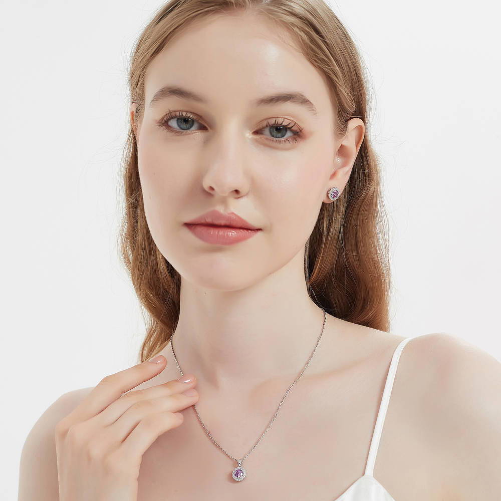 Model wearing Halo Kaleidoscope CZ Stud Earrings in Sterling Silver, Purple