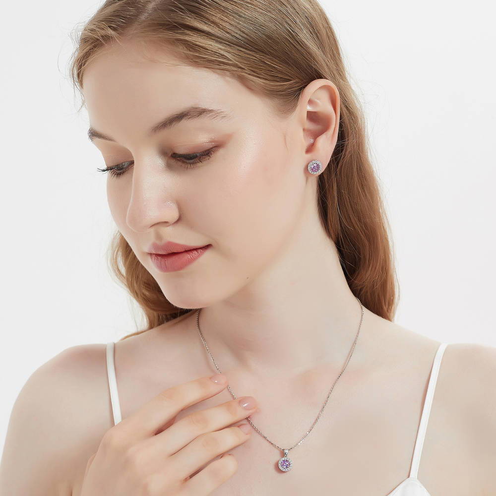 Model wearing Halo Kaleidoscope CZ Stud Earrings in Sterling Silver, Purple