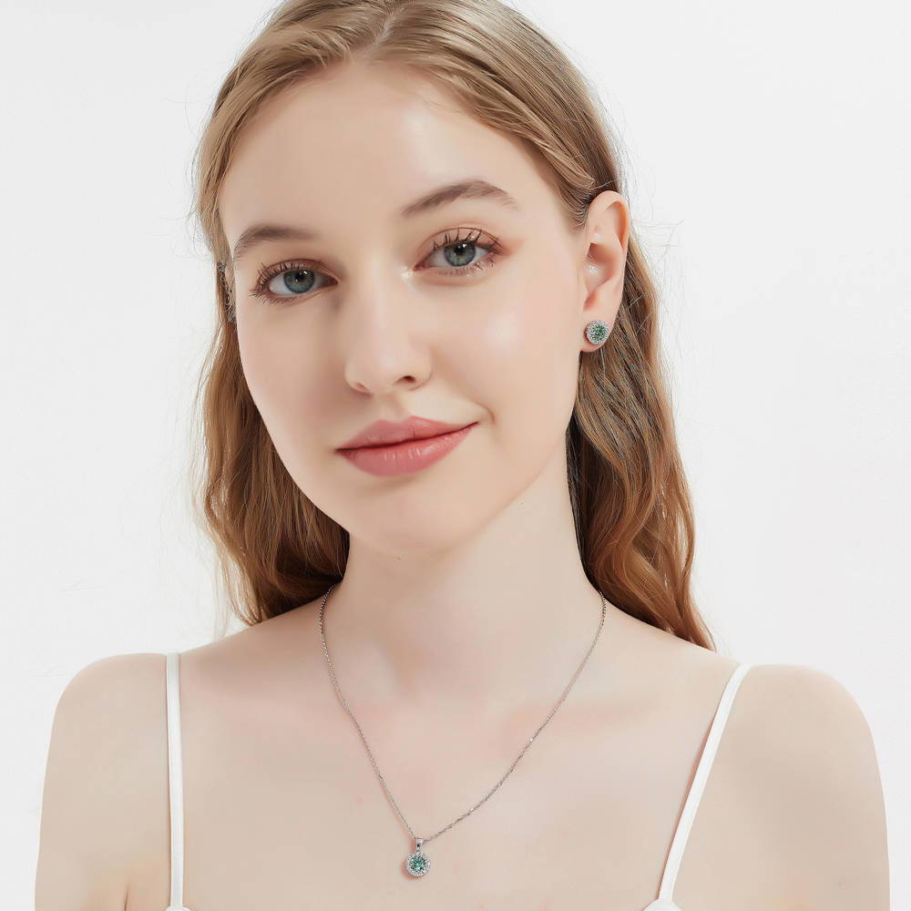 Model wearing Halo Kaleidoscope CZ Stud Earrings in Sterling Silver, Green