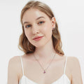 Model wearing Halo Kaleidoscope CZ Stud Earrings in Sterling Silver, Red