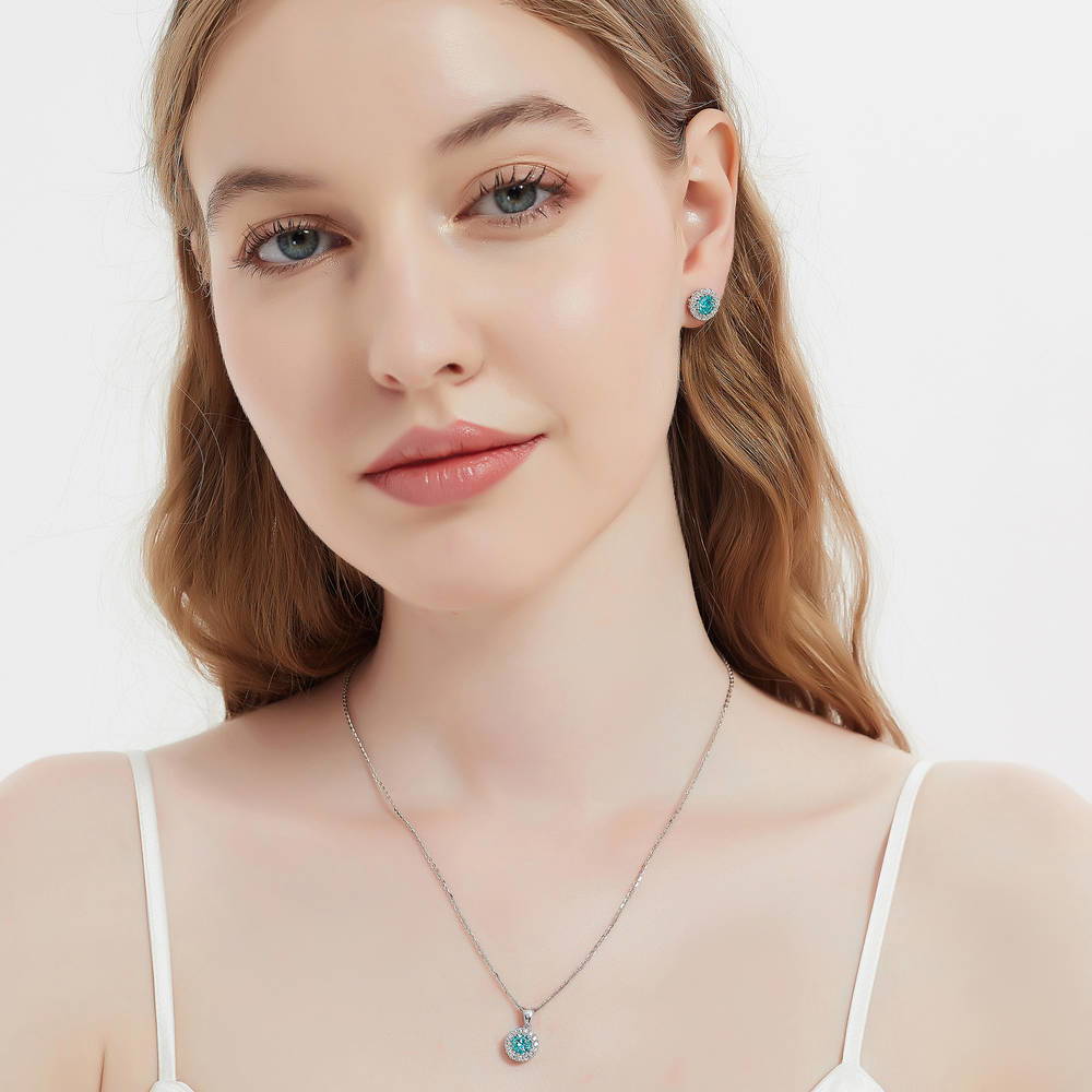 Model wearing Halo Kaleidoscope CZ Stud Earrings in Sterling Silver, Frosty Mint